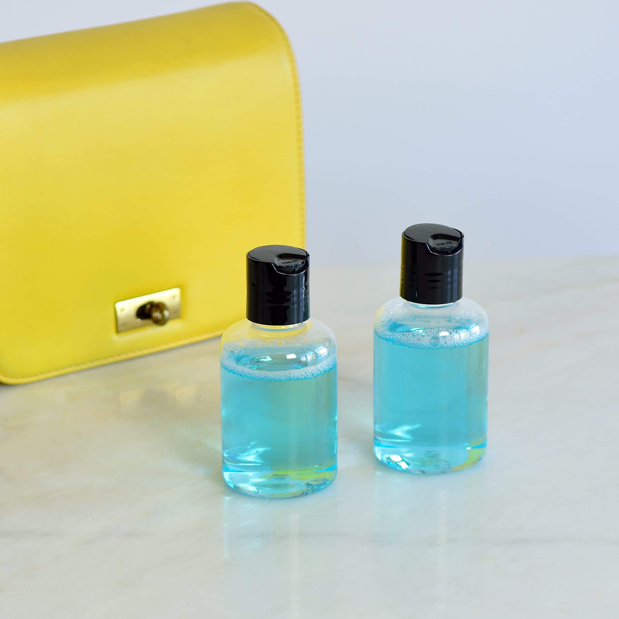 Youngever 12 Pack 4 Ounce Empty Squeeze Containers with Disc Cap, Plastic Bottles with Disc Top Flip Cap, Refillable Cosmetic Bottles, Squeeze Containers